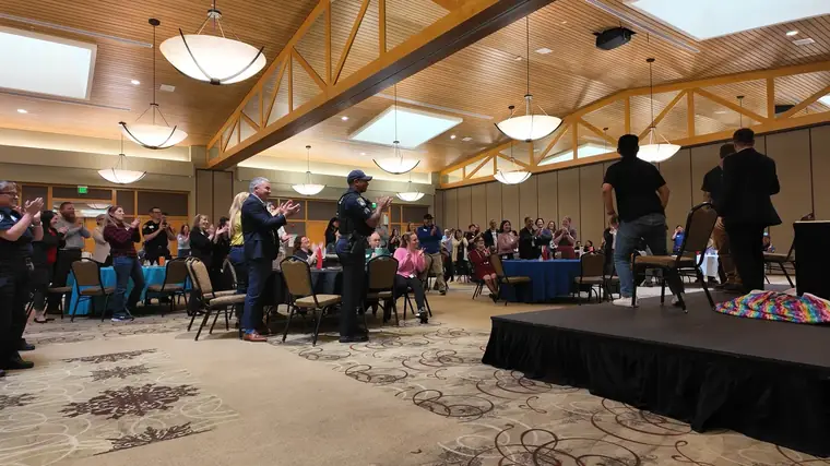 Keynote on stage with volunteers