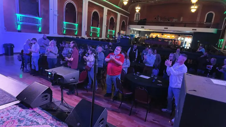 Standing ovation in an ornate theater